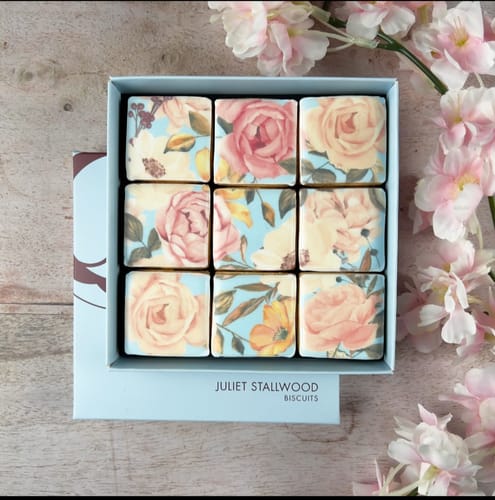Customer's Floral Blooms Biscuit Box presented open with nine beautifully decorated square biscuits.