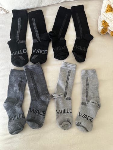Customer shows their collection of Men's Alpaca Socks in black and grey.