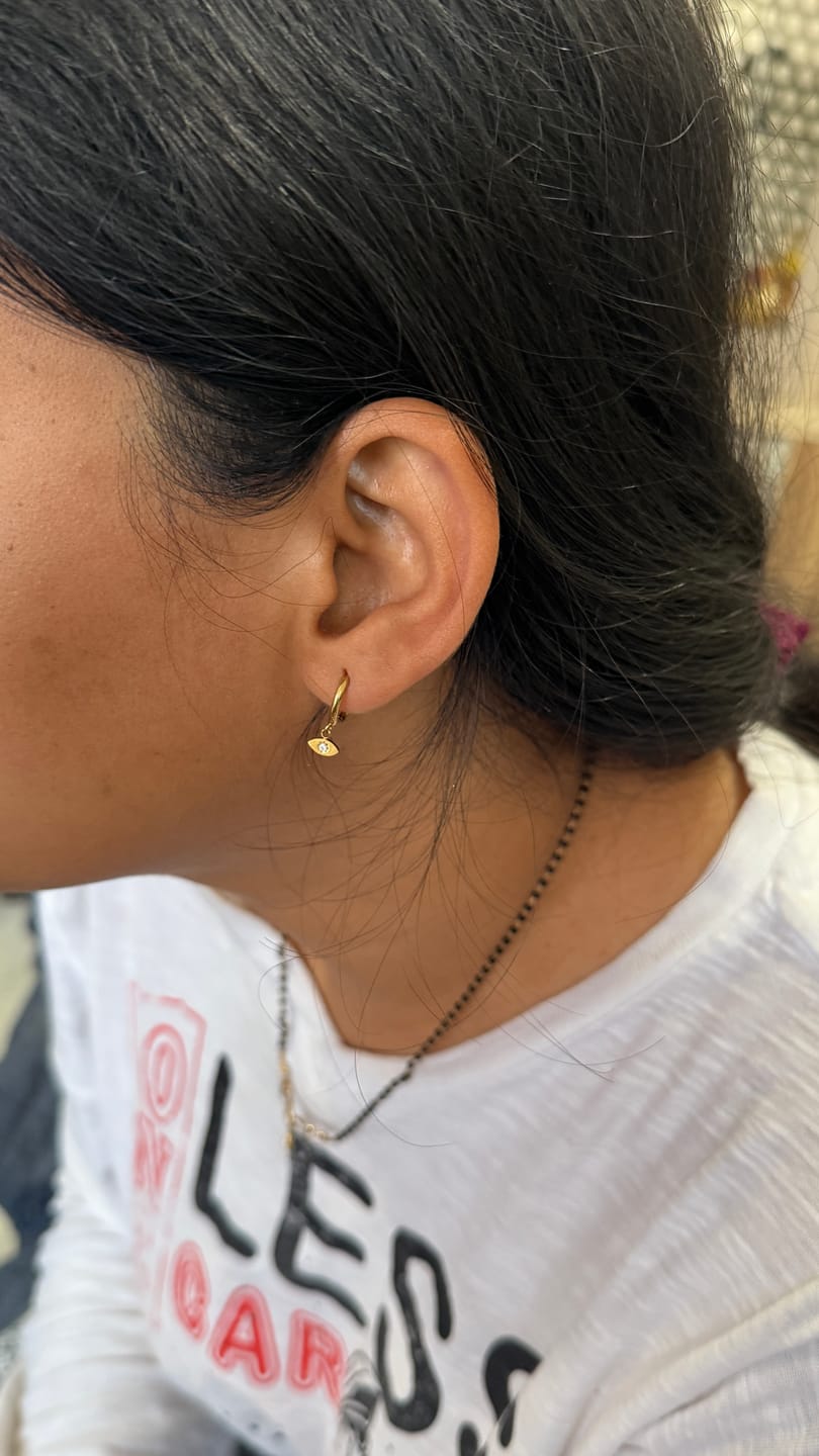 Customer photo review of Tiny Iris Star Hoop Earrings