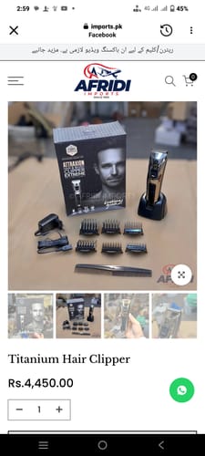 Customer's Titanium Hair Clipper set with its box, charging base, and multiple comb attachments laid out on a surface.