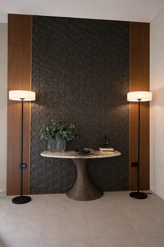 Customer shows two Crescent LED floor lamps illuminating a modern entryway on either side of a round table.