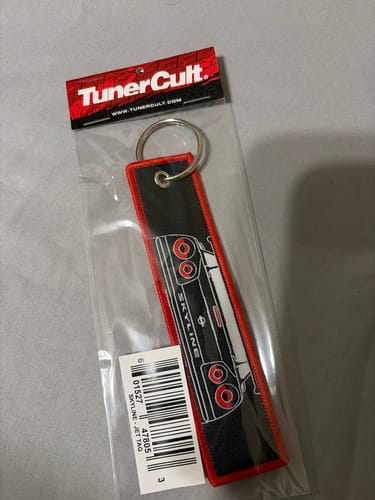 Reviewer's embroidered SKYLINE JET TAG with red trim, still in its original clear packaging.
