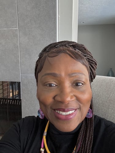 Reviewer smiling in a close-up photo.