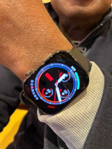 Customer's Gard Pro Health Smartwatch 3 on their wrist, showing a bright, colorful watch face with health data.