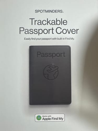 Customer's photo of the packaging for the black Trackable Passport Cover, showing its Apple Find My compatibility.