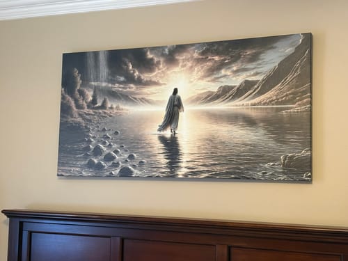 Customer's 'Walking on Water' wall art hanging on a beige wall above a dark wood bed headboard.
