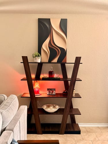 Customer's Modern Abstract Minimalist Wall Art placed on top of a dark, A-frame shelf.