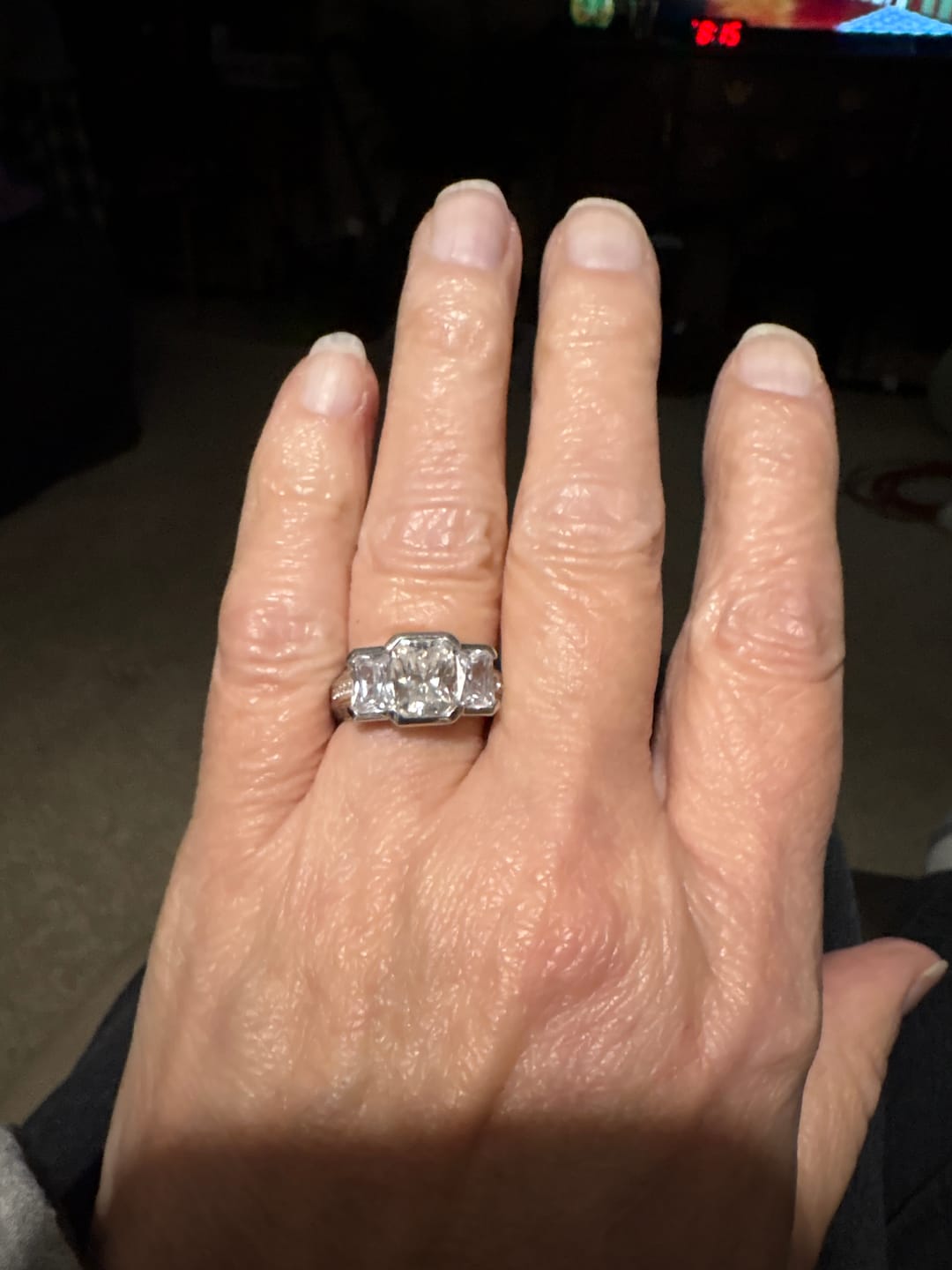Customer photo review of Three Stone Radiant Moissanite Staircase Channel Set Euro Engagement Ring