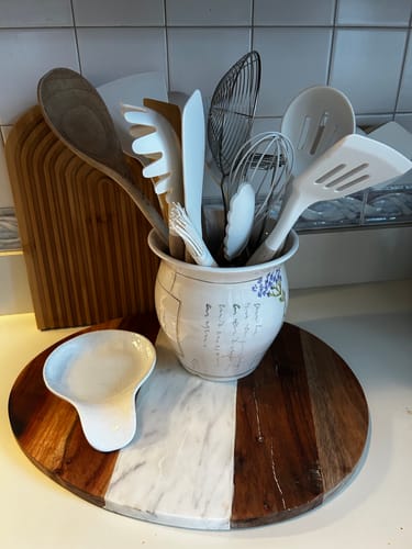 Customer's white Silicone Utensils Set displayed in a decorative holder on a kitchen counter.
