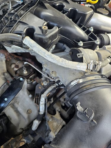 Reviewer's close-up of a Ford Powerstroke 6.7L engine before installing the EGR & Cooler Delete Kit.