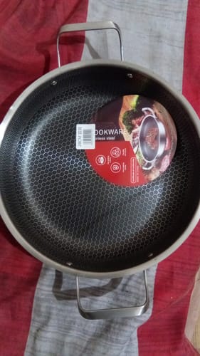 Customer's new silver Honeycomb Pan showing the textured interior and two handles.