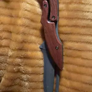 Customer photo review of Damascus Steel Folding Knife with Wood Handle - Mechanical Magic Pocket Knife