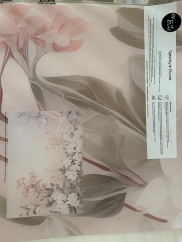 Customer's large sample of the Serenity in Bloom Wallpaper Mural, showing the floral pattern and a small reference photo.