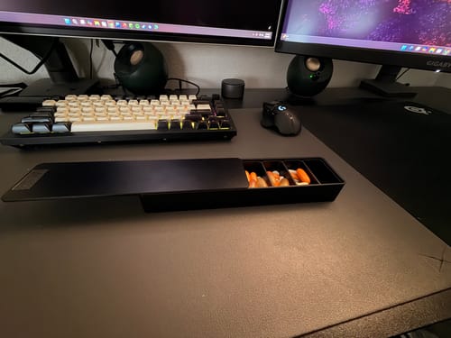 Reviewer's black Weekly Case open on a desk, showing several compartments filled with pills.