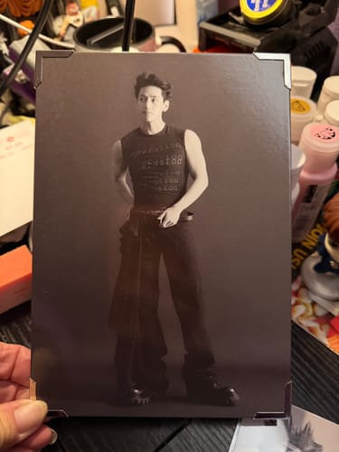 Reviewer holds a large, sepia-toned print of V from the TYPE 非 photobook set.
