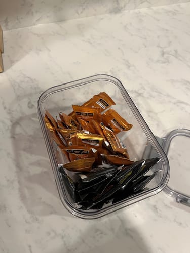 Customer's SuperCharged Honey variety pack packets organized in a clear storage container.
