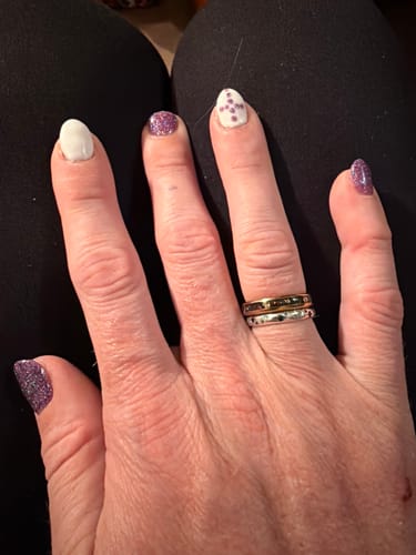 Customer wearing their gold Vireon 4mm ring stacked with a second silver-colored ring.