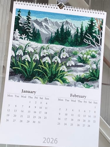 Reviewer's finished Crystal Art Calendar showing the January/February page with a sparkling winter snowdrop scene.