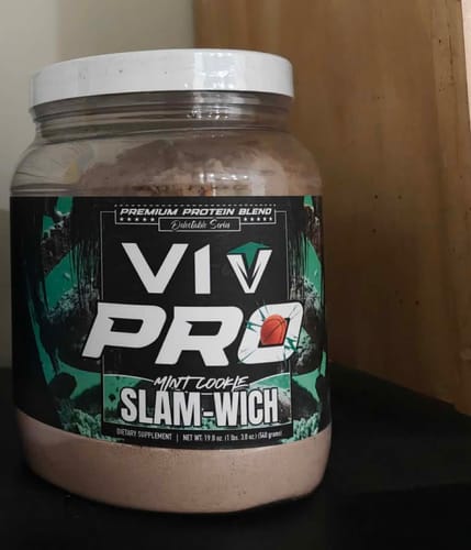Customer's clear tub of V1 PRO protein powder in Mint Cookie Slam-wich flavor.