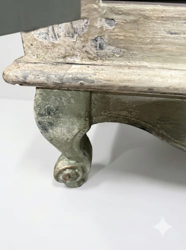 Customer's close-up of an armoire leg with a distressed finish using green Topiary milk paint.