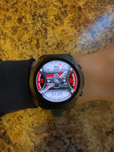Customer's Gard Pro Ultra 2+ smartwatch on their wrist, showing a detailed digital and analog watch face.