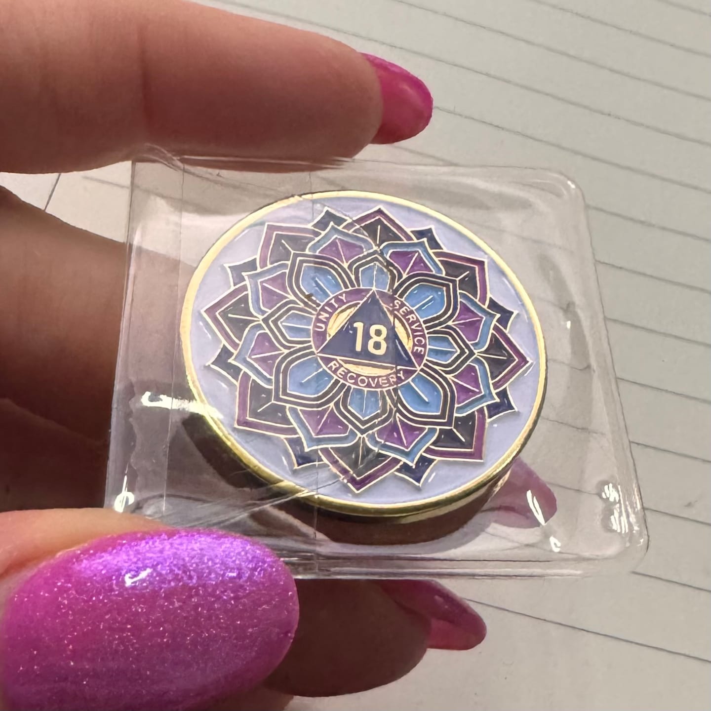 Customer photo review of 18 Year Sobriety Mint 'In Bloom' Lotus Flower Gold Plated AA Recovery Medallion - Eighteen Year Chip/Coin - White