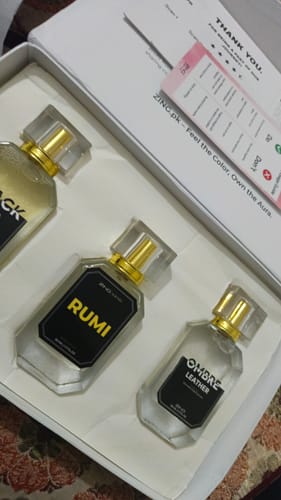 Customer's Signature Perfumes Bundle showing three glass perfume bottles in their white presentation box.