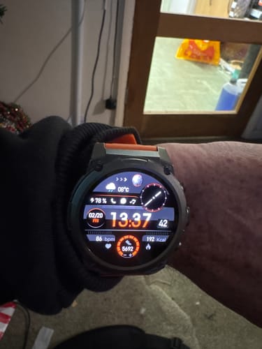 Customer's black Gard Pro Ultra 3 smartwatch on their wrist, displaying a digital face with health metrics.