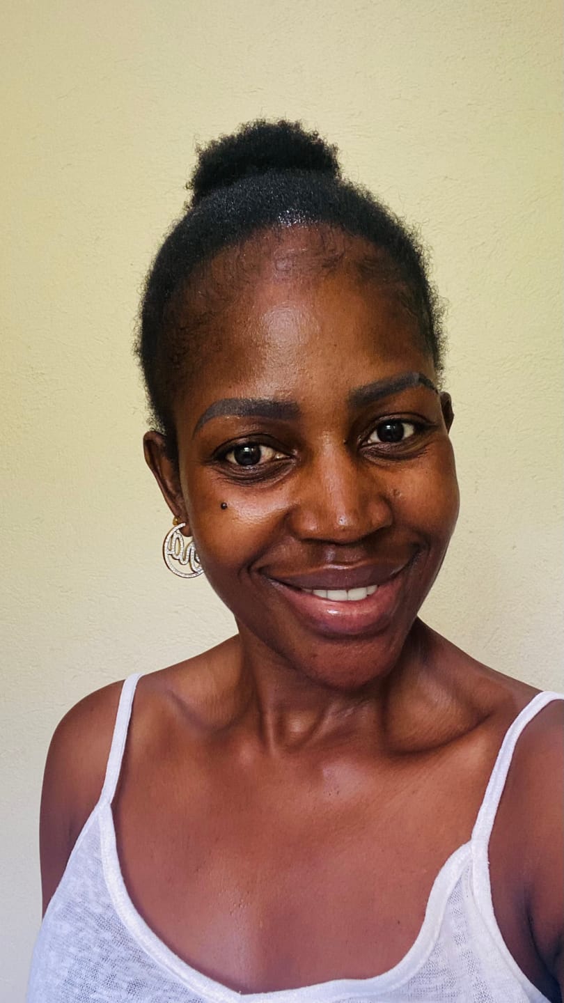 Customer photo review of Gold Luxe Mini Logo Hoops