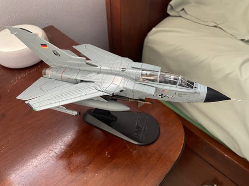 Customer's detailed Hobbymaster Tornado IDS 1/72 model in grey, shown on its display stand on a wooden desk.