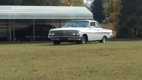 Reviewer's classic white car, a project completed using the sandpaper.