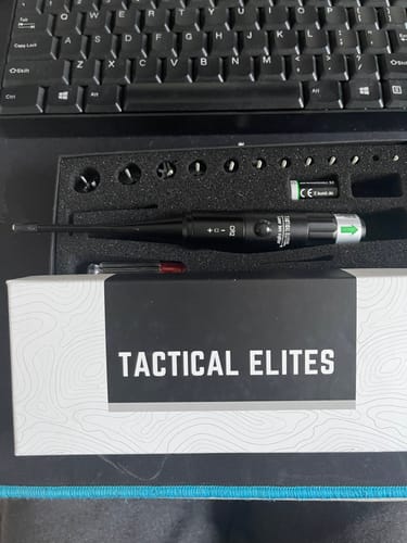 Customer's Site Right™ 2.0 - Boresighter kit displayed in its open foam case with various attachments and batteries.