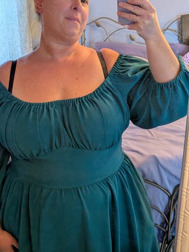 Customer's close-up of the Vacation Dress in Teal, showing the gathered neckline and bishop sleeve.