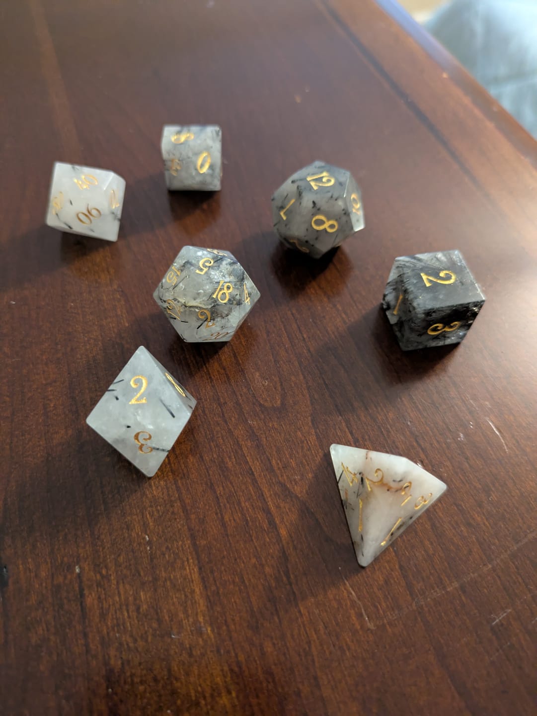 Customer photo review of URWizards D&D Black Rutilated Quartz Gemstone Engraved Dice Set(Limited edition)