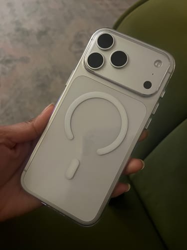 Customer holding a silver iPhone in the Anti Yellow Magsafe Transparent Clear Case, showing the back and MagSafe magnet.