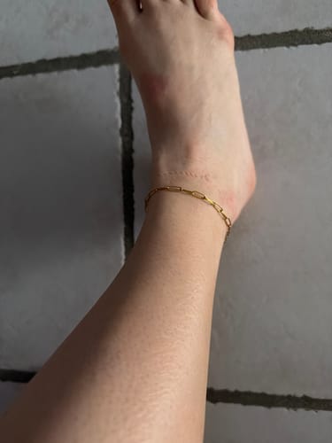 Reviewer showing how they wear the Maui Paperclip Bracelet as a simple anklet.
