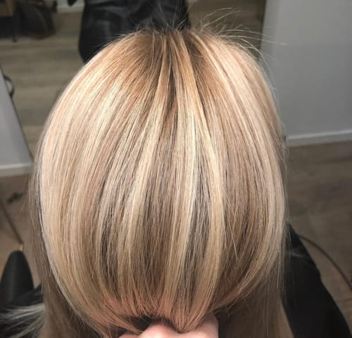 Customer's hair from behind, showing golden blonde results after using the Sunkissed Starter Kit.
