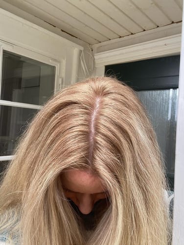 Customer showing the result of the Sunkissed Refill, with lightened blonde hair and blended roots.