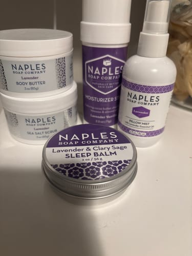 Customer's Lavender Dreams Gift Set products, including balm, butter, and mist, arranged on a white counter.