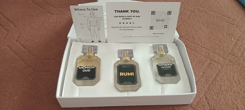 Customer's OUD Supreme BUNDLE unboxed, showing three fragrance bottles inside the white presentation box.