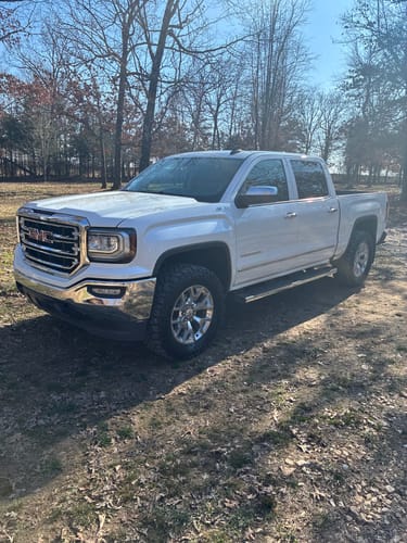 Customer's white GMC Sierra 1500 after installing the 2-inch front leveling lift kit, creating a level stance.