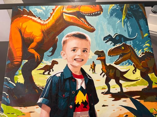 Customer's completed Dinosaur Safari Paint by Numbers canvas, showing a portrait of a boy with several dinosaurs.