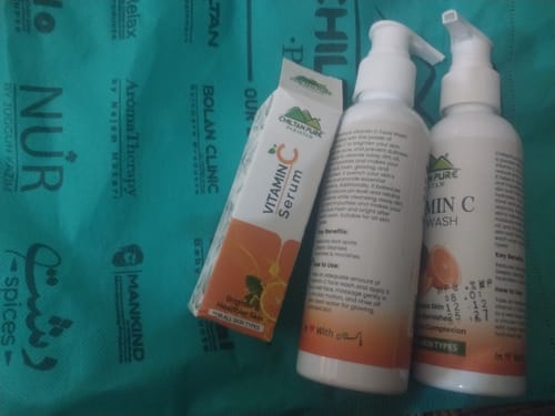 Customer's two bottles of ChiltanPure Vitamin C Face Wash and a Vitamin C Serum box on a green branded bag.