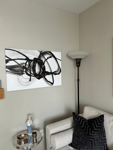 Customer's 'Monochromatic Electromagnetic Fields' canvas hung on a gray wall in their living room.