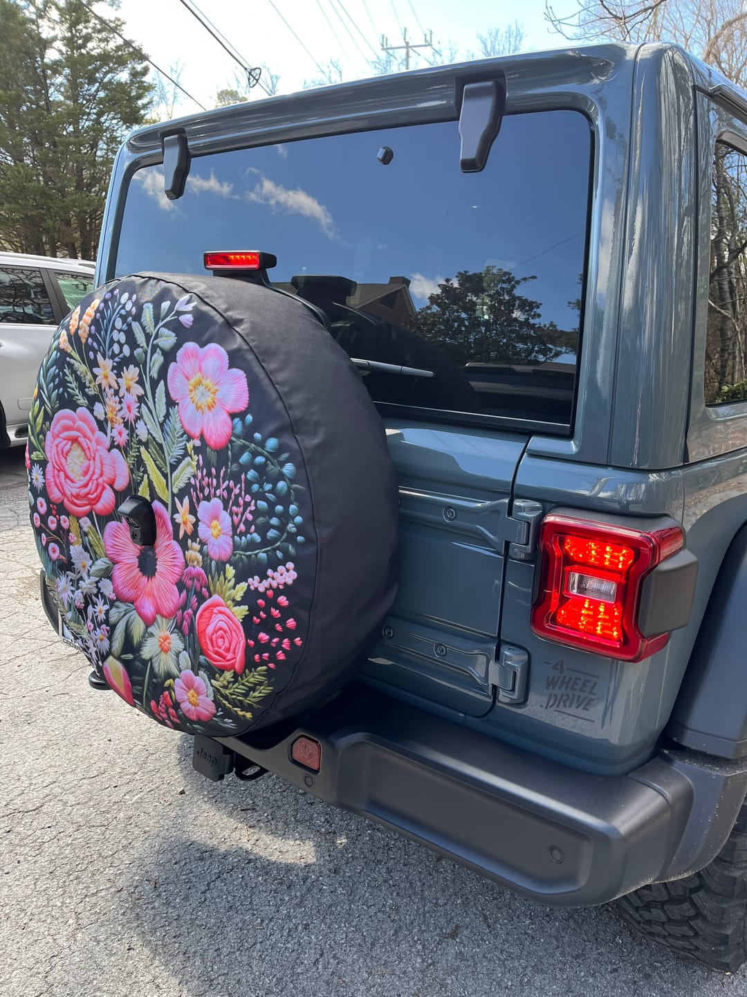 Customer photo review of Pink Flowers Spare Tire Cover, Faux Embroidery Printed Floral Wheel Accessories Unique Design Backup Camera Hole Trailer Back Women RV Gift