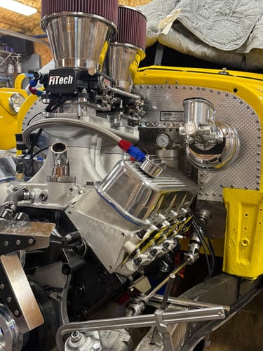 Reviewer's photo showing a custom engine build utilizing Fluidworks performance parts like the pass thru fitting.