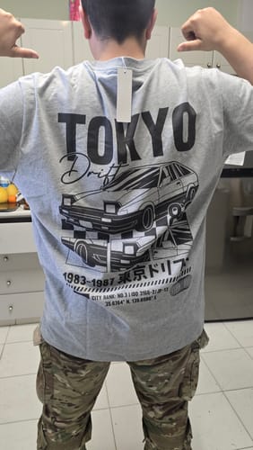 Reviewer from behind wearing the grey Tokyo Drift T-Shirt. The large back graphic is visible and the fit appears slightly large.