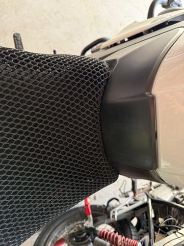Customer's close-up of the Wind Rider Seat Cover's bulky front edge on a motorcycle seat.