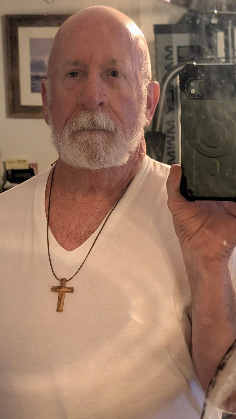 Customer photo review of Holy Land Plain Olive Wood Cross Pendant
