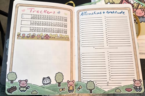 Customer's journal spread decorated with cute pig-themed stickers and washi tape from the Ultimate Subscription.